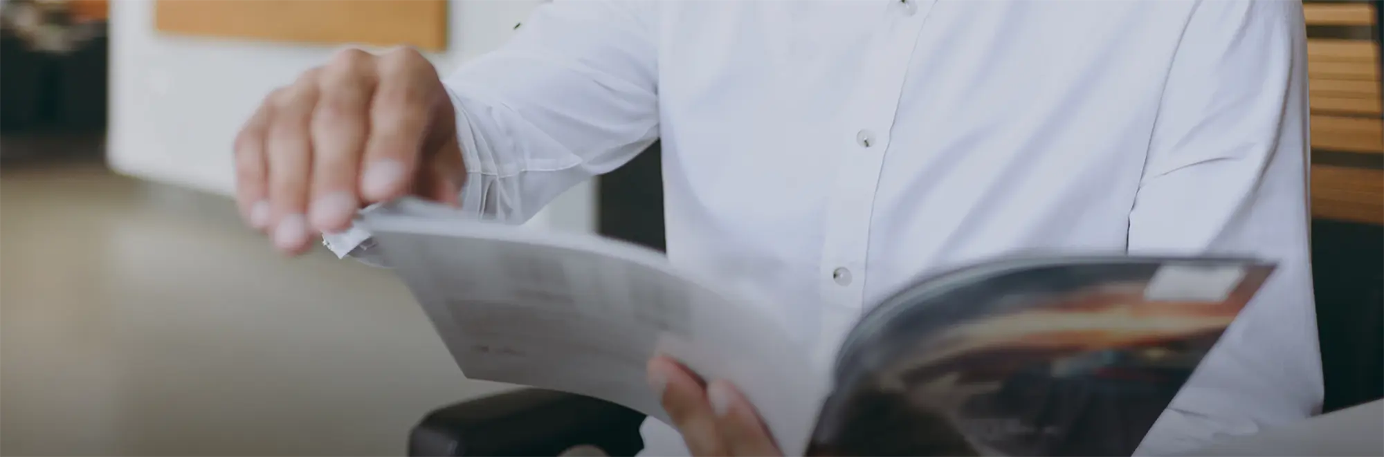Businessman paging through a catalog