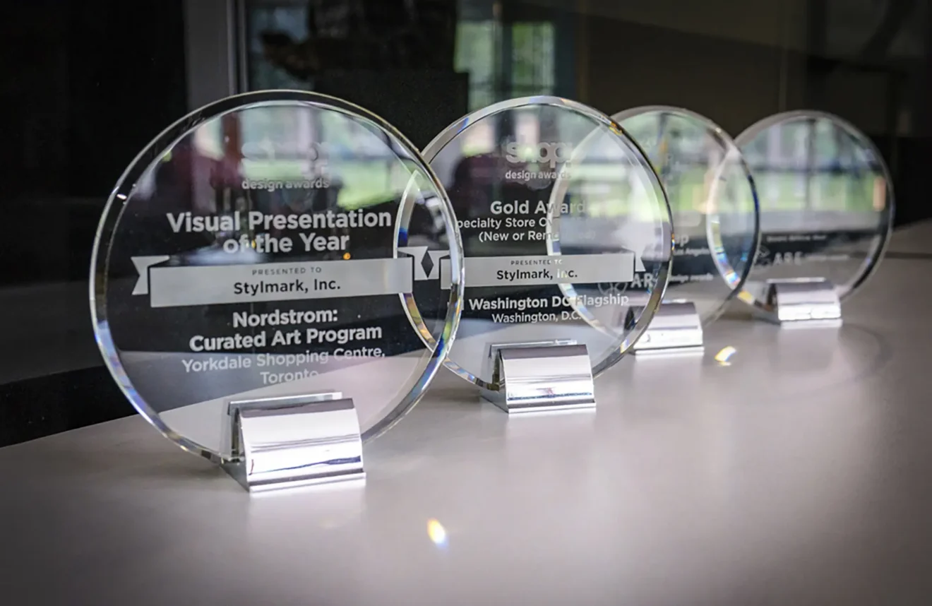 Table view of four Stylmark Visual Presentation of the Year awards